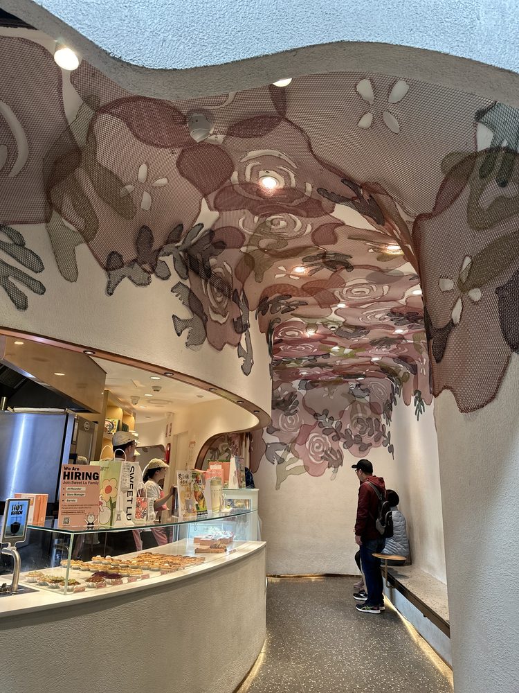 The floral mesh ceiling and pastry counter at Sweet Lu bakery, Chinatown