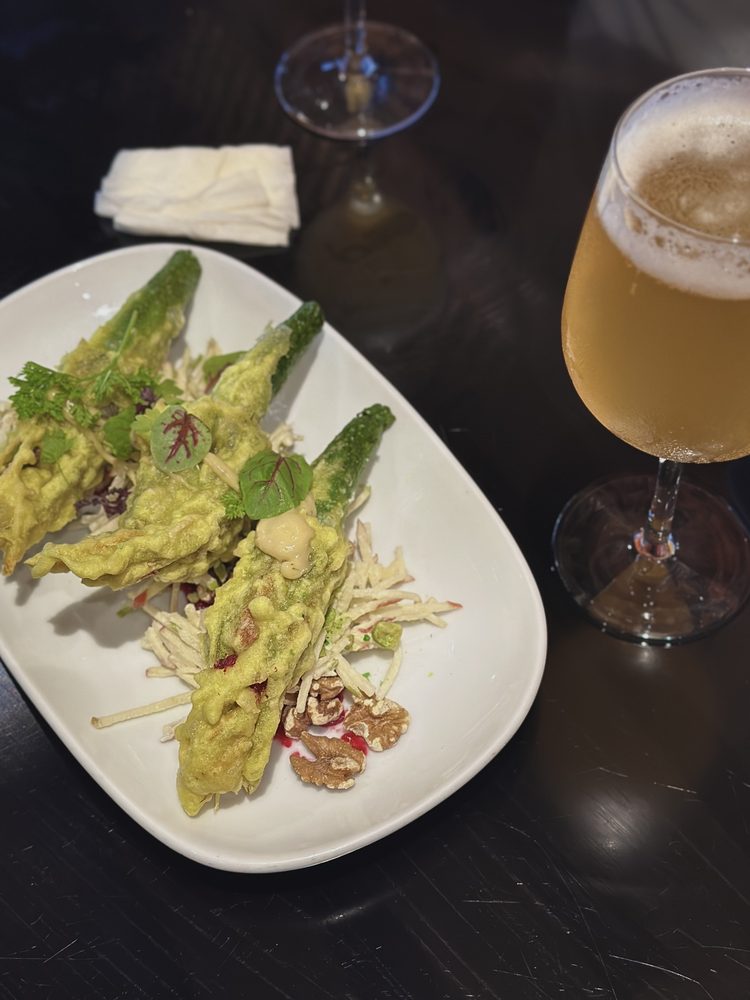 Tempura zucchini flowers with walnut salad, a Surry Hills laneway dish