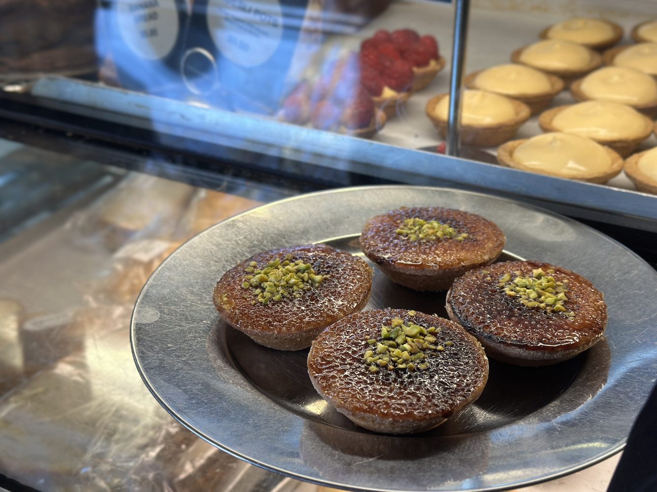 Bakery display case of pastries and tarts in Surry Hills