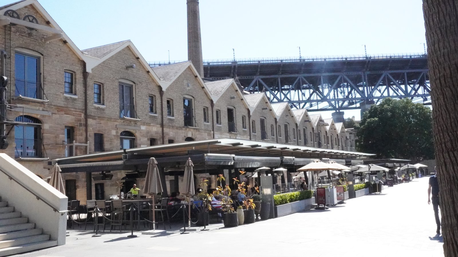Sandstone wharf buildings beneath the Harbour Bridge at Campbells Cove