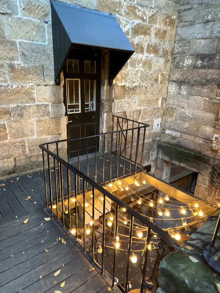 Sandstone balcony and fairy lights on a historic Rocks building
