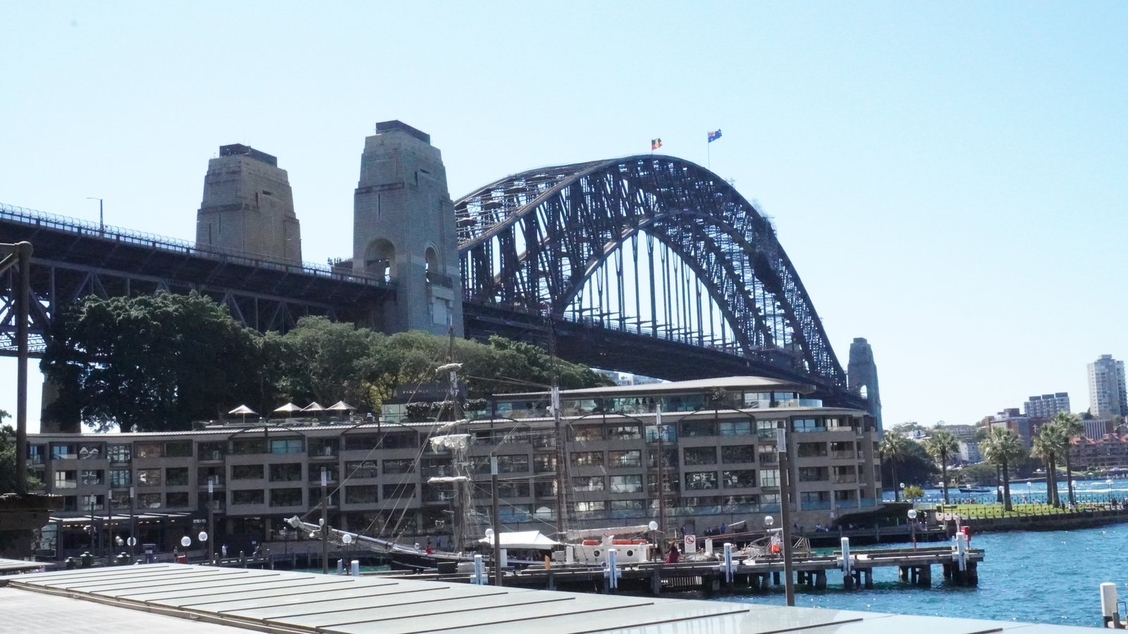 Sydney Harbour Bridge pylons and a tall ship moored at Campbells Cove